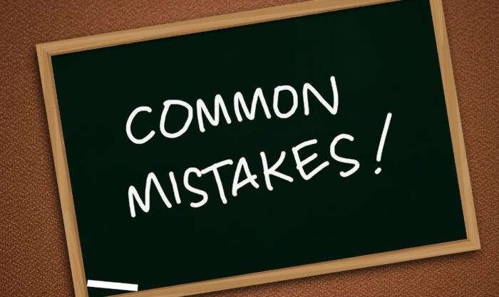 Chalkboard with a wooden frame showing the words 'Common Mistakes!' written in white chalk.